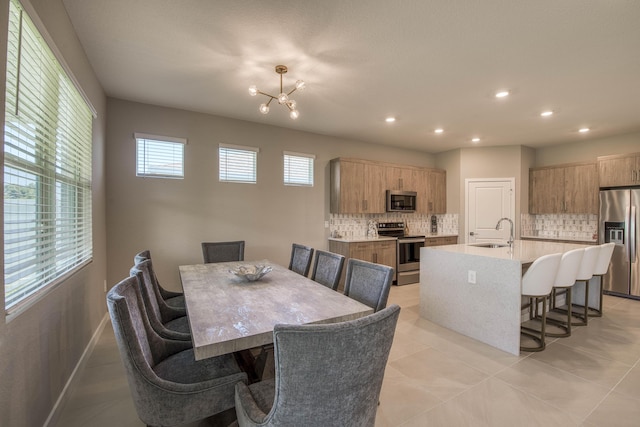 1878 NE Ocean Dunes Dr, Jensen Beach, FL 34957 - dining area featuring a chandelier, recessed lighting, and light tile patterned floors