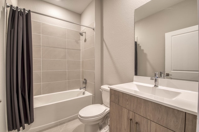 1878 NE Ocean Dunes Dr, Jensen Beach, FL 34957 - full bath featuring a textured wall, shower / bath combo with shower curtain, vanity, and tile patterned floors