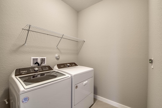 1878 NE Ocean Dunes Dr, Jensen Beach, FL 34957 - washroom with washing machine and clothes dryer and baseboards