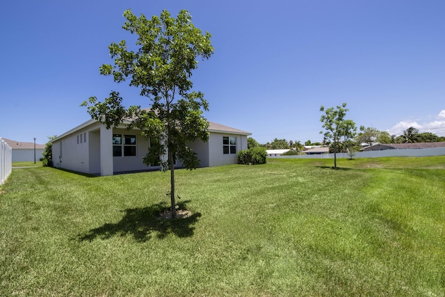 1878 NE Ocean Dunes Dr, Jensen Beach, FL 34957 - view of green lawn
