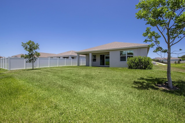 1878 NE Ocean Dunes Dr, Jensen Beach, FL 34957 - back of house featuring stucco siding
