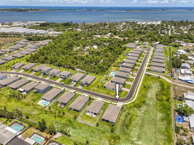 1878 NE Ocean Dunes Dr, Jensen Beach, FL 34957 - aerial view of property's location with nearby suburban area and a nearby body of water