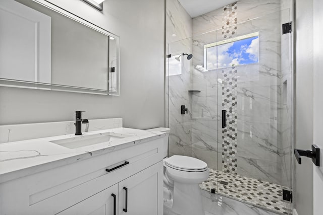 3257 SE Snow Rd, Port Saint Lucie, FL 34984 - bathroom with vanity, a marble finish shower, and marble finish floors