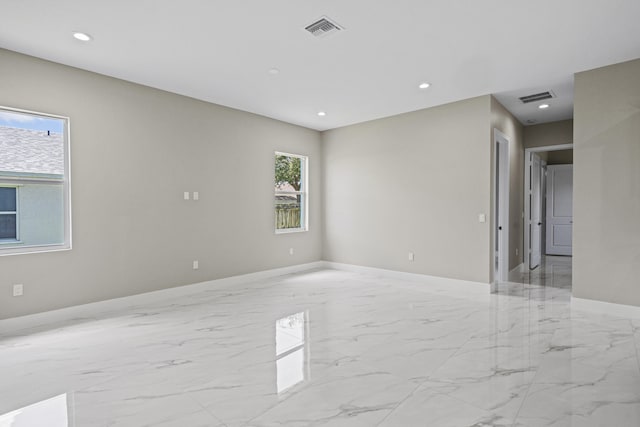 3257 SE Snow Rd, Port Saint Lucie, FL 34984 - unfurnished room featuring light marble finish floors and recessed lighting