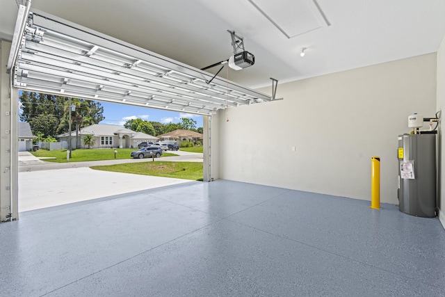 3257 SE Snow Rd, Port Saint Lucie, FL 34984 - garage with water heater, a garage door opener, and a residential view