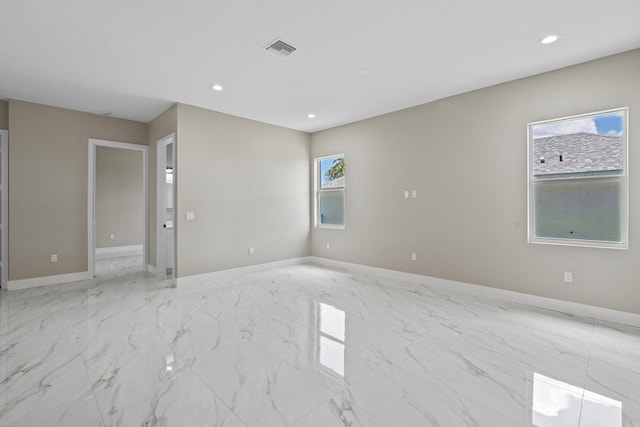 3257 SE Snow Rd, Port Saint Lucie, FL 34984 - empty room featuring light marble finish flooring and recessed lighting
