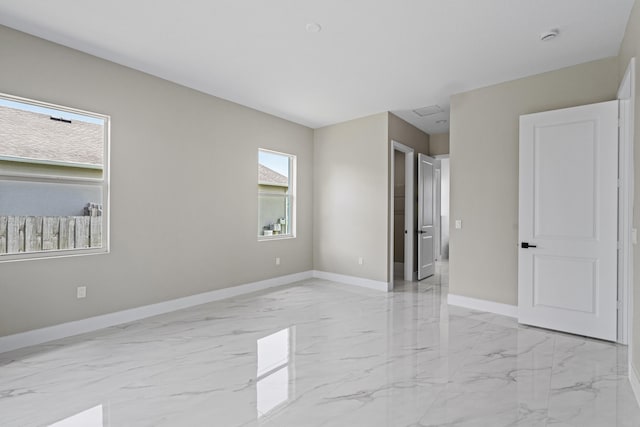 3257 SE Snow Rd, Port Saint Lucie, FL 34984 - unfurnished bedroom featuring light marble finish flooring