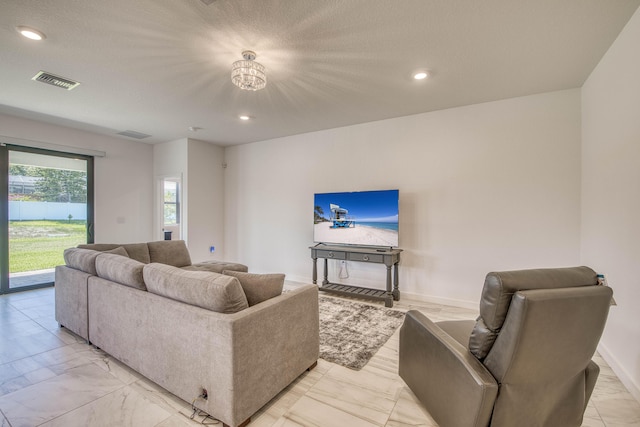 1850 NE Ocean Dunes Dr, Jensen Beach, FL 34957 - living area with light marble finish floors and recessed lighting