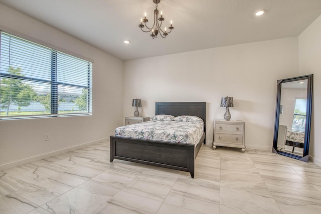1850 NE Ocean Dunes Dr, Jensen Beach, FL 34957 - bedroom with a chandelier, light marble finish floors, and recessed lighting
