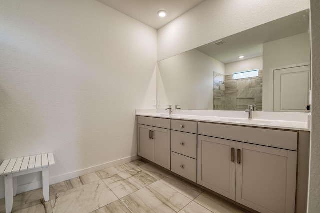 1850 NE Ocean Dunes Dr, Jensen Beach, FL 34957 - bathroom featuring marble look tiles, walk in shower, double vanity, and recessed lighting