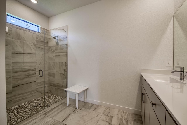 1850 NE Ocean Dunes Dr, Jensen Beach, FL 34957 - bathroom with a stall shower, vanity, marble finish flooring, and recessed lighting