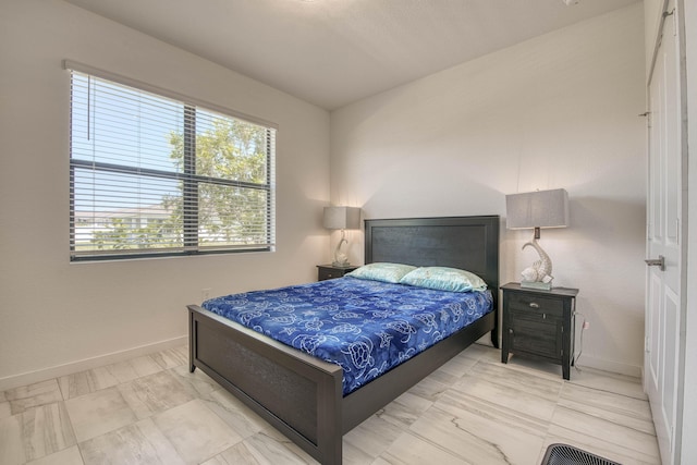 1850 NE Ocean Dunes Dr, Jensen Beach, FL 34957 - bedroom with marble finish flooring and baseboards