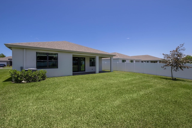 1850 NE Ocean Dunes Dr, Jensen Beach, FL 34957 - rear view of property featuring stucco siding