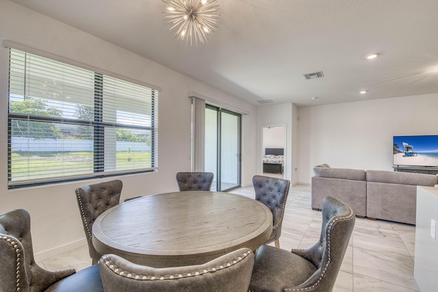 1850 NE Ocean Dunes Dr, Jensen Beach, FL 34957 - dining area featuring a chandelier, light marble finish flooring, and recessed lighting
