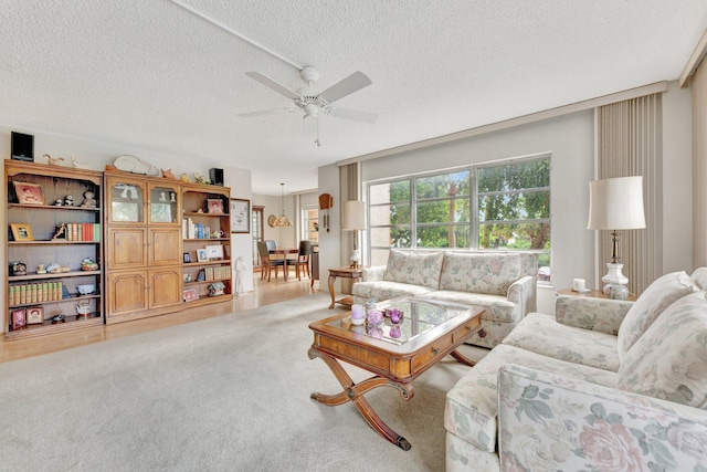 10777 W Sample Rd Unit 207, Coral Springs, FL 33065 - carpeted living room featuring a textured ceiling and a ceiling fan