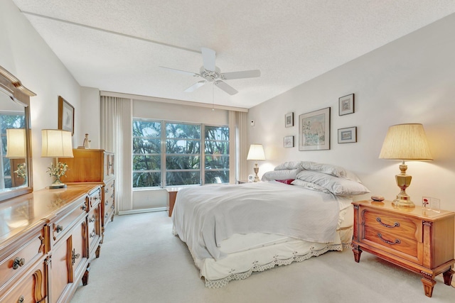 10777 W Sample Rd Unit 207, Coral Springs, FL 33065 - bedroom with light colored carpet, multiple windows, a textured ceiling, and ceiling fan