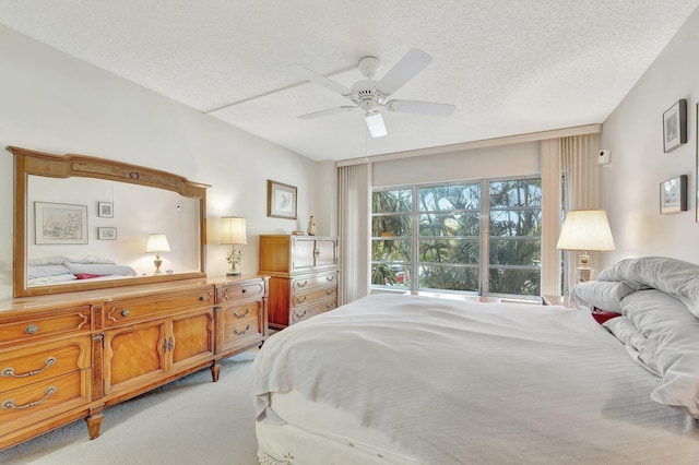10777 W Sample Rd Unit 207, Coral Springs, FL 33065 - carpeted bedroom with a textured ceiling and ceiling fan
