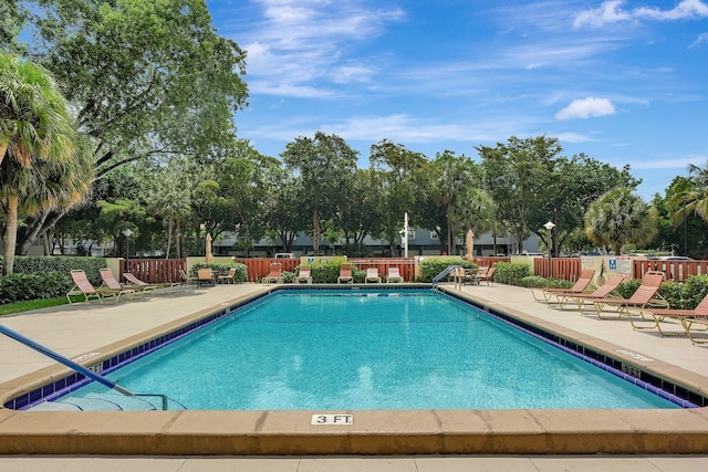 10777 W Sample Rd Unit 207, Coral Springs, FL 33065 - community pool featuring a patio area
