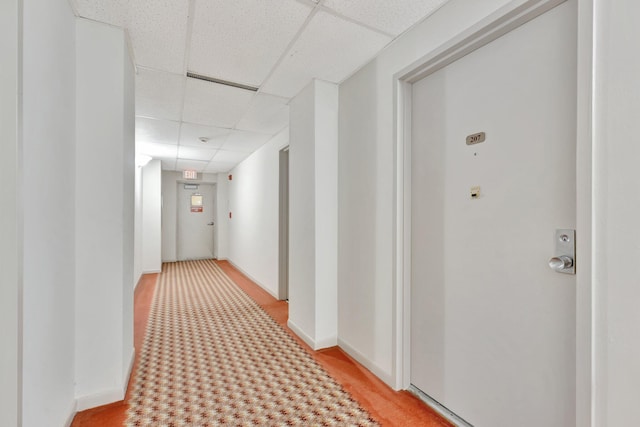 10777 W Sample Rd Unit 207, Coral Springs, FL 33065 - corridor with a drop ceiling and baseboards