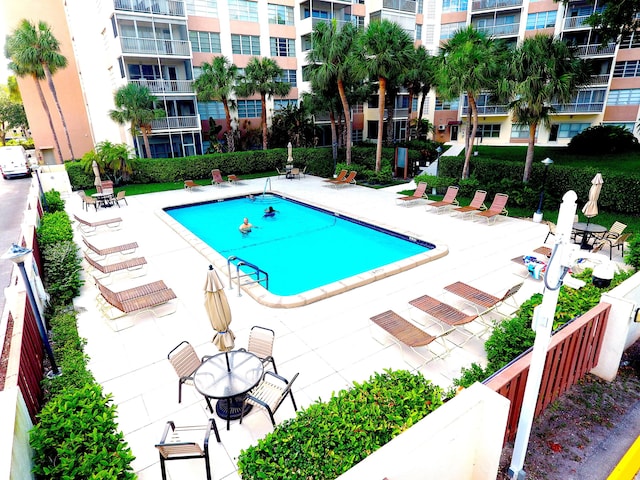 10777 W Sample Rd Unit 207, Coral Springs, FL 33065 - community pool featuring a patio