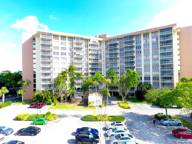 10777 W Sample Rd Unit 207, Coral Springs, FL 33065 - view of apartment building / complex with uncovered parking
