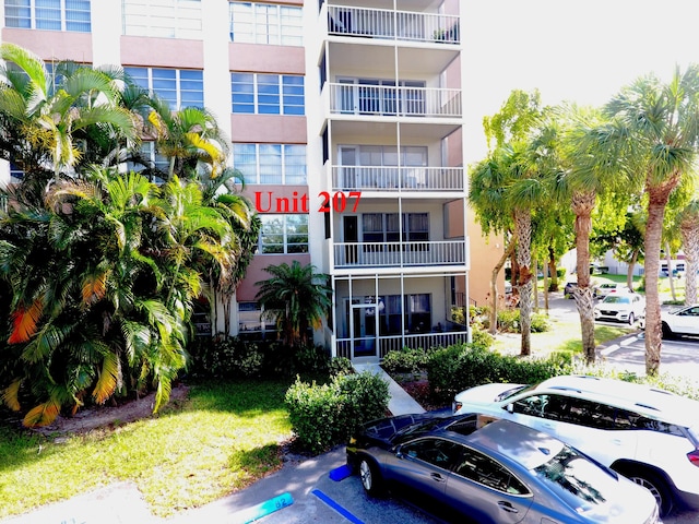 10777 W Sample Rd Unit 207, Coral Springs, FL 33065 - view of apartment building / complex with uncovered parking