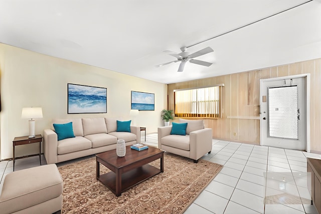444 Saxony J, Delray Beach, FL 33446 - living room with ceiling fan, light tile patterned floors, and wooden walls