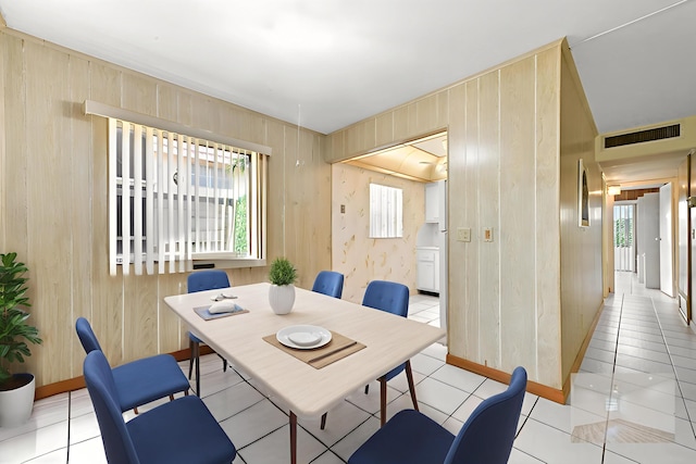 444 Saxony J, Delray Beach, FL 33446 - dining area with wooden walls and light tile patterned floors