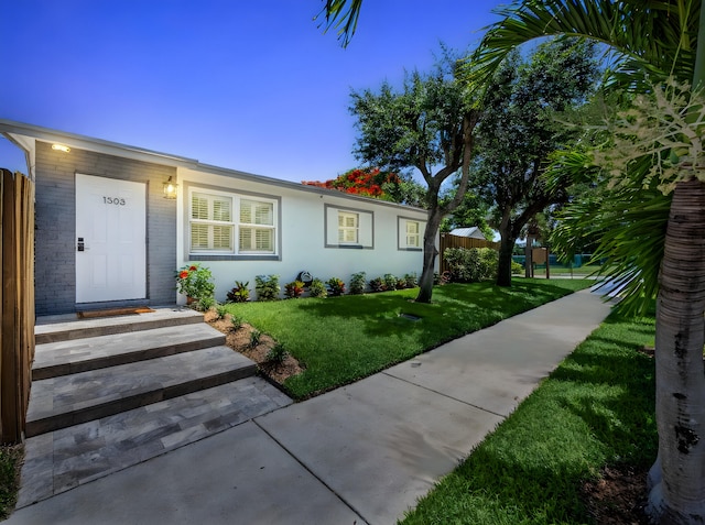 1303 NW 2nd St, Delray Beach, FL 33444 - ranch-style home featuring a front yard and brick siding