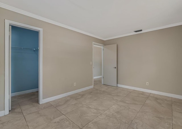 732 Neil Rd Unit 1-4, West Palm Beach, FL 33415 - unfurnished bedroom with ornamental molding, a spacious closet, and a closet