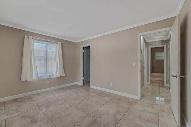732 Neil Rd Unit 1-4, West Palm Beach, FL 33415 - unfurnished room featuring crown molding and light marble finish flooring