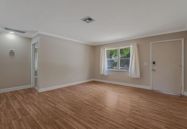 732 Neil Rd Unit 1-4, West Palm Beach, FL 33415 - empty room with ornamental molding and wood finished floors