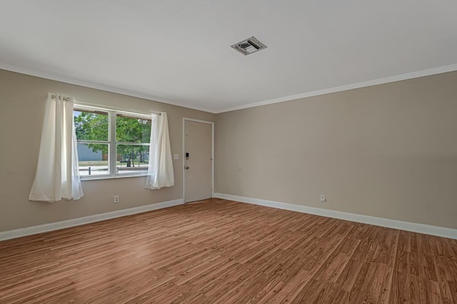 732 Neil Rd Unit 1-4, West Palm Beach, FL 33415 - unfurnished room with wood finished floors and crown molding