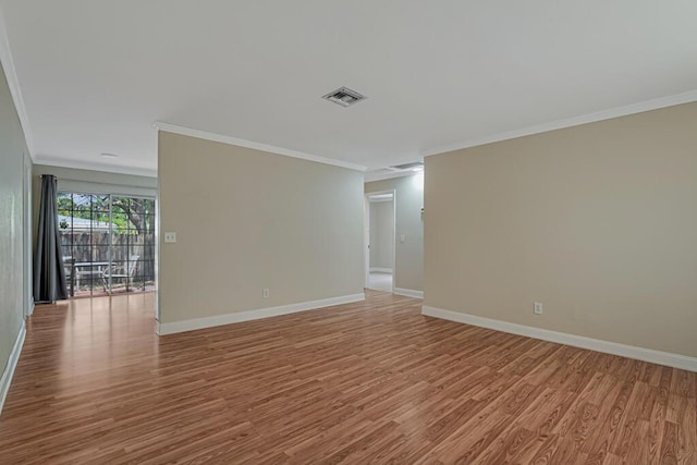 732 Neil Rd Unit 1-4, West Palm Beach, FL 33415 - empty room with ornamental molding and wood finished floors