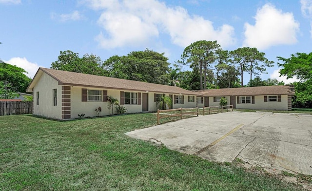 732 Neil Rd Unit 1-4, West Palm Beach, FL 33415 - rear view of house featuring stucco siding and a patio area