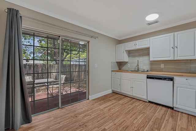 732 Neil Rd Unit 1-4, West Palm Beach, FL 33415 - kitchen featuring dishwasher, light wood-style floors, tasteful backsplash, crown molding, and white cabinets