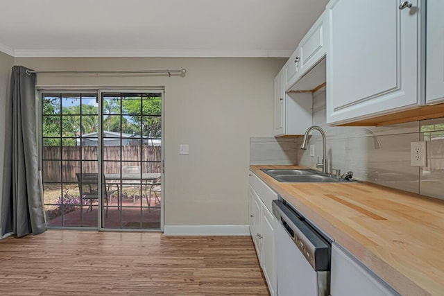 732 Neil Rd Unit 1-4, West Palm Beach, FL 33415 - kitchen with dishwasher, wooden counters, white cabinets, decorative backsplash, and ornamental molding