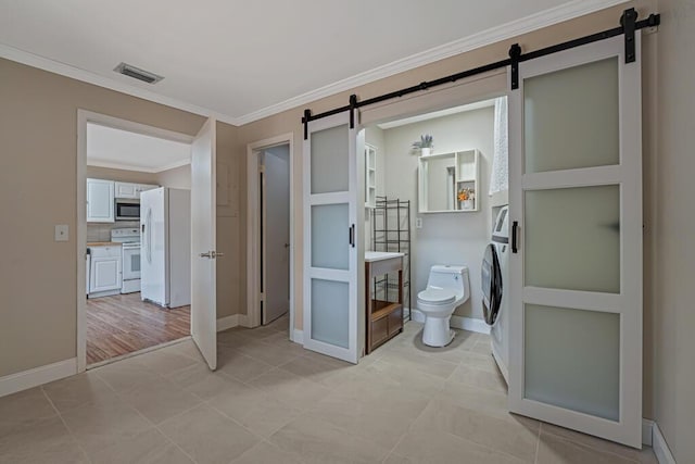 732 Neil Rd Unit 1-4, West Palm Beach, FL 33415 - bathroom featuring ornamental molding, vanity, and washer / clothes dryer