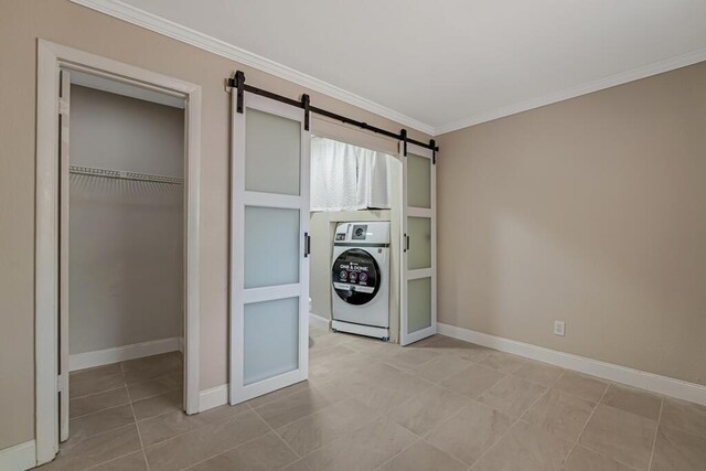 732 Neil Rd Unit 1-4, West Palm Beach, FL 33415 - laundry area with washer / dryer, a barn door, crown molding, and light tile patterned flooring