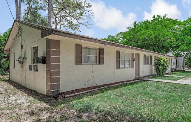 732 Neil Rd Unit 1-4, West Palm Beach, FL 33415 - view of front of home with a front yard and stucco siding