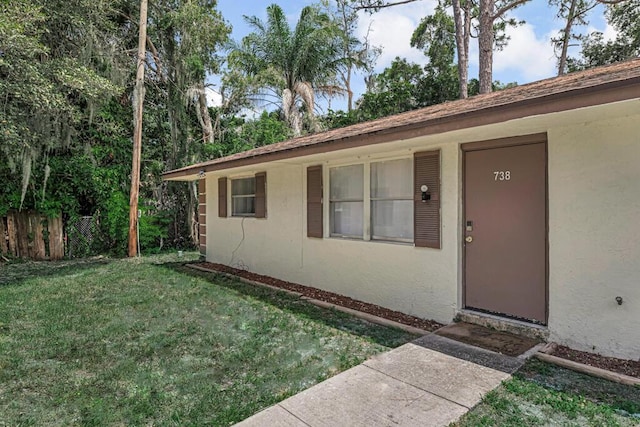 732 Neil Rd Unit 1-4, West Palm Beach, FL 33415 - view of exterior entry with stucco siding