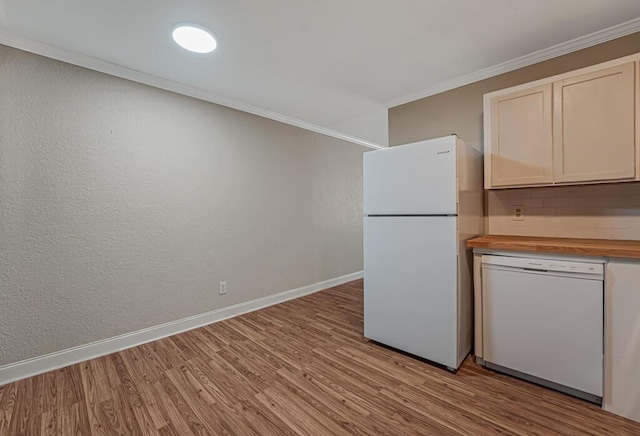 732 Neil Rd Unit 1-4, West Palm Beach, FL 33415 - kitchen with white appliances, light wood-style floors, wooden counters, and crown molding