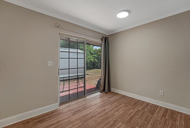732 Neil Rd Unit 1-4, West Palm Beach, FL 33415 - empty room featuring wood finished floors and crown molding
