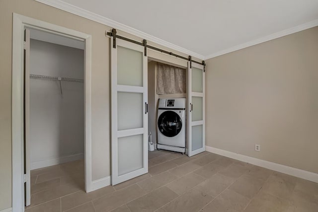 732 Neil Rd Unit 1-4, West Palm Beach, FL 33415 - laundry area with washer / dryer, a barn door, crown molding, and tile patterned floors