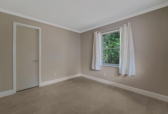 732 Neil Rd Unit 1-4, West Palm Beach, FL 33415 - spare room featuring ornamental molding and baseboards