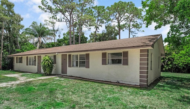 732 Neil Rd Unit 1-4, West Palm Beach, FL 33415 - ranch-style home with a front lawn, stucco siding, and a shingled roof