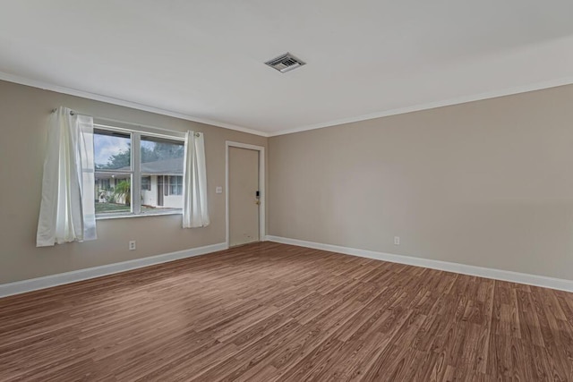 732 Neil Rd Unit 1-4, West Palm Beach, FL 33415 - spare room featuring wood finished floors and crown molding