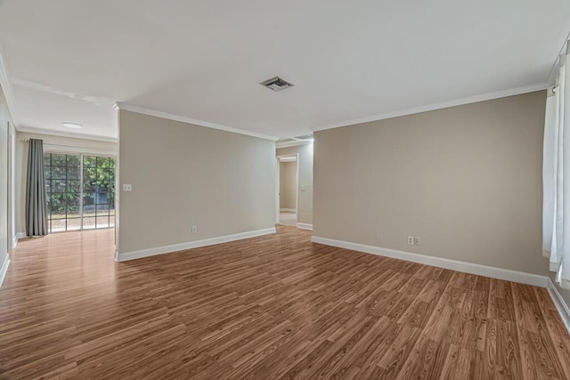 732 Neil Rd Unit 1-4, West Palm Beach, FL 33415 - spare room featuring wood finished floors and crown molding