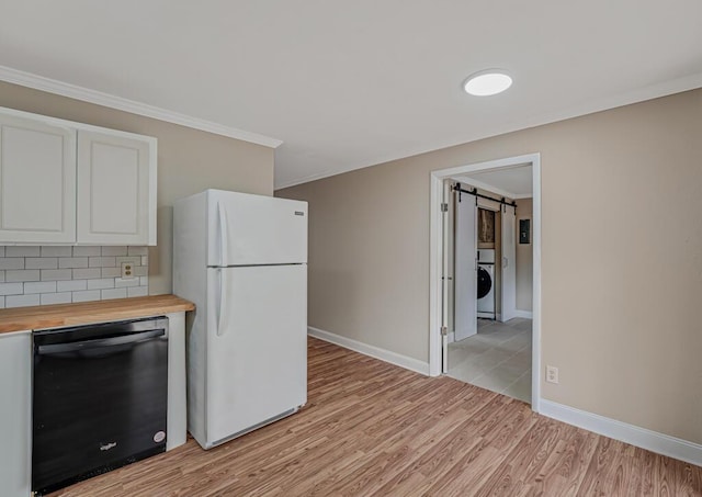 732 Neil Rd Unit 1-4, West Palm Beach, FL 33415 - kitchen with black dishwasher, freestanding refrigerator, butcher block countertops, light wood finished floors, and ornamental molding