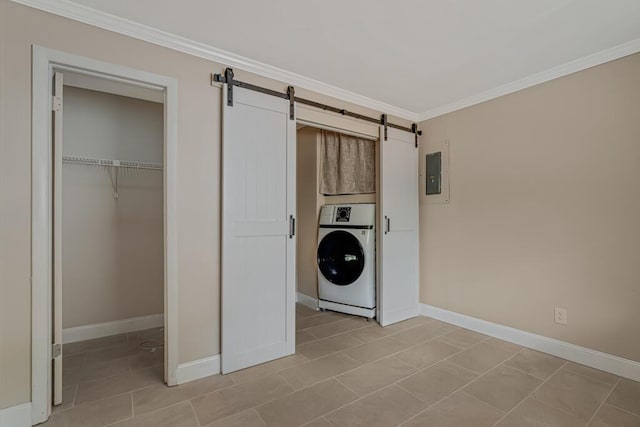 732 Neil Rd Unit 1-4, West Palm Beach, FL 33415 - washroom with a barn door, electric panel, crown molding, light tile patterned floors, and stacked washer and clothes dryer